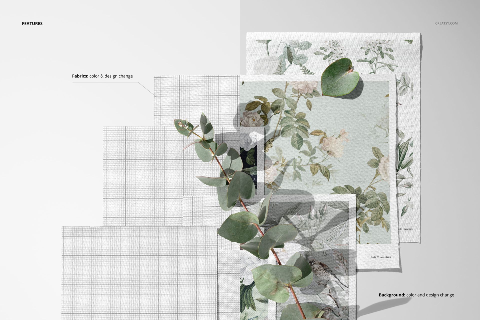 PSD mockup showing layered cotton fabric swatches with nature-inspired prints and a eucalyptus branch, top view.