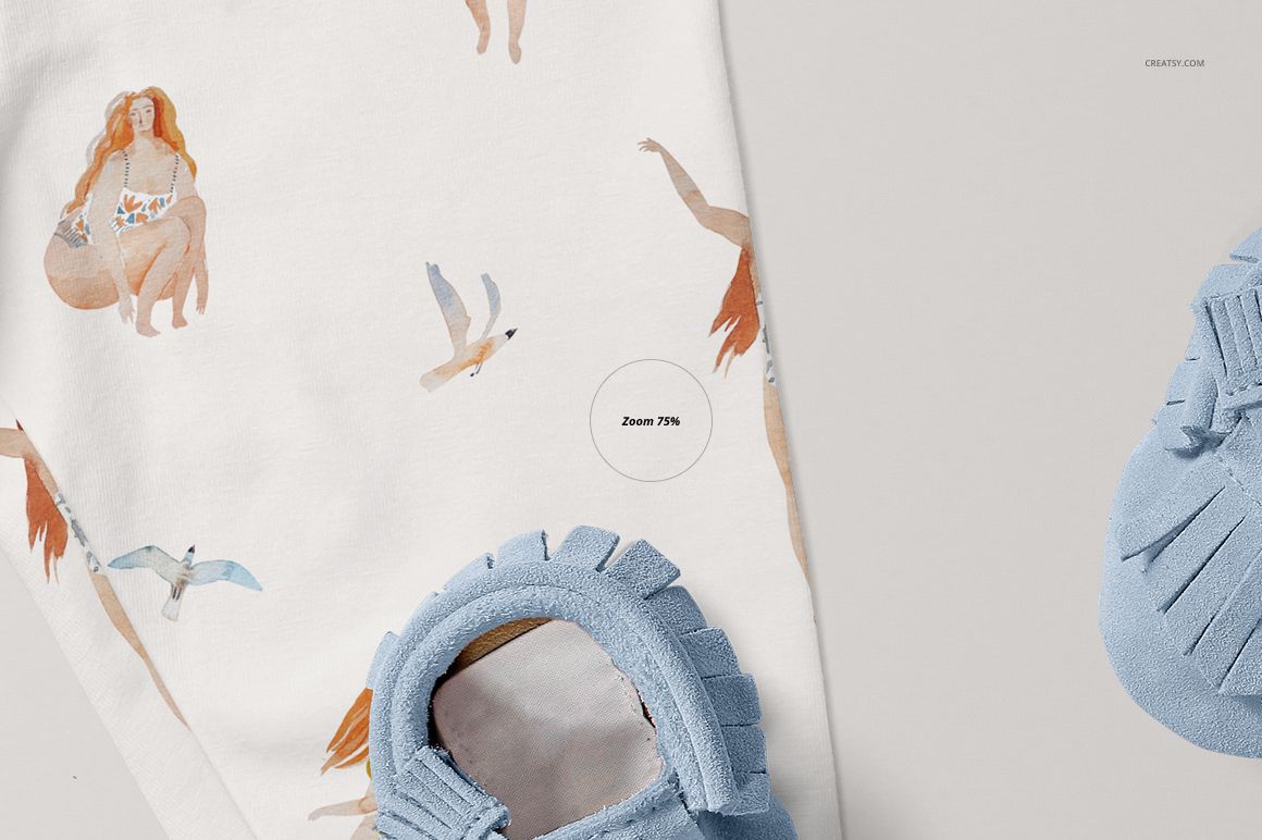 Baby leggings mockup featuring a close-up of white fabric with illustrated figures and birds, next to blue moccasin shoes.