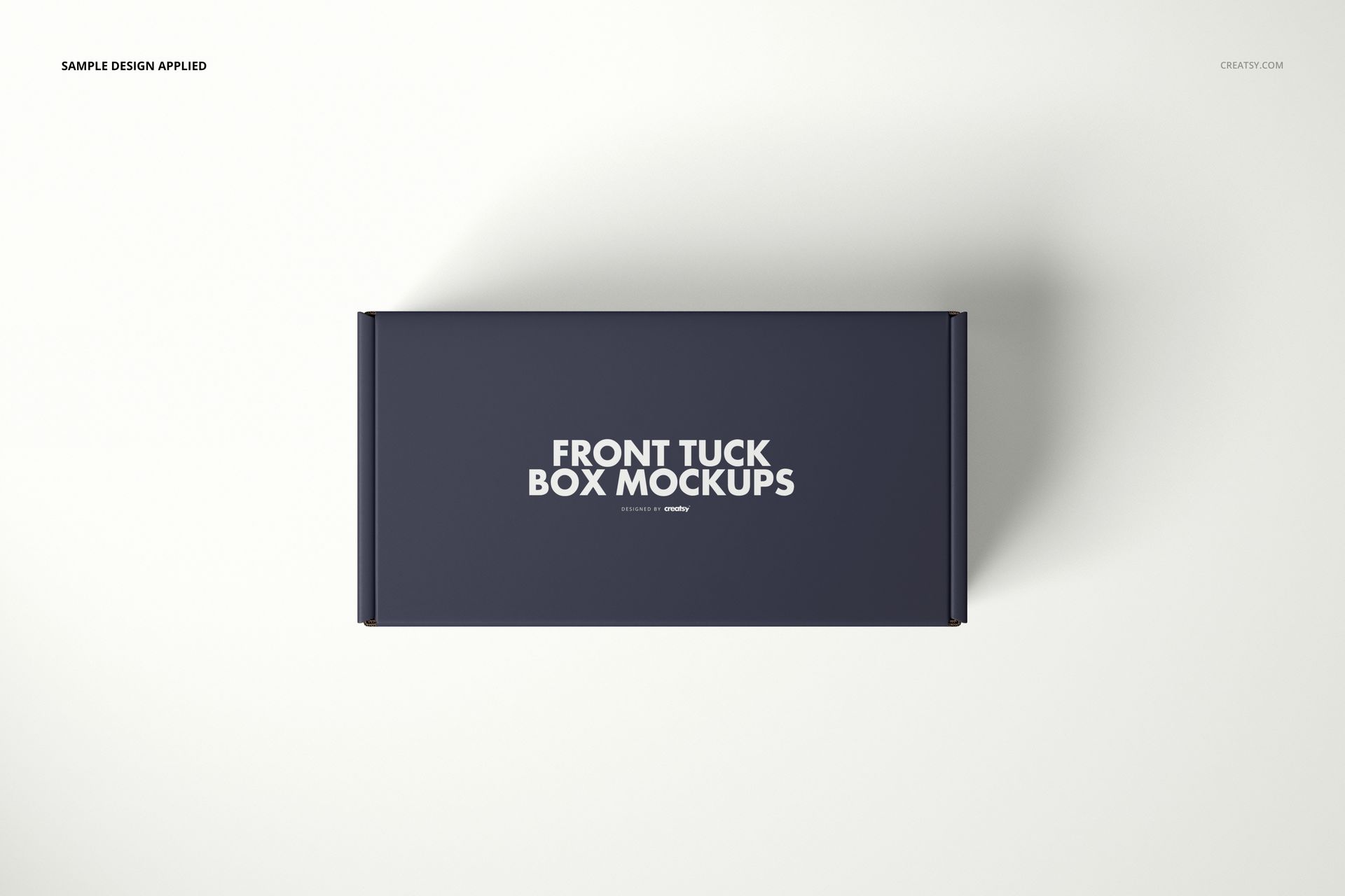 Front view of a navy blue mailer box mockup with white text, placed on a plain light surface.
