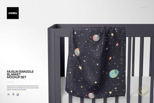 PSD mockup of a muslin swaddle blanket with space-themed print displayed on a crib, nursery scene with soft lighting.