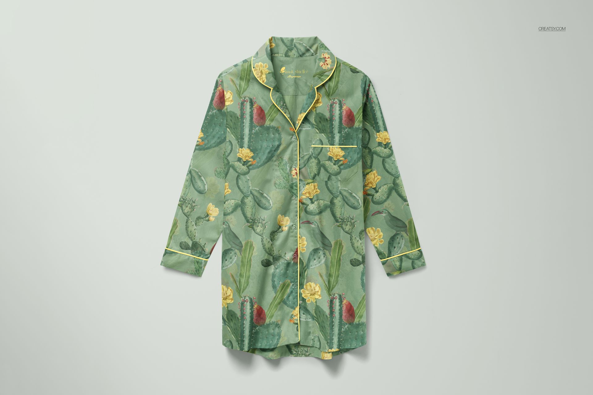 PSD mockup of a sleepwear nightdress featuring a botanical cactus and flower print, displayed against a plain backdrop.