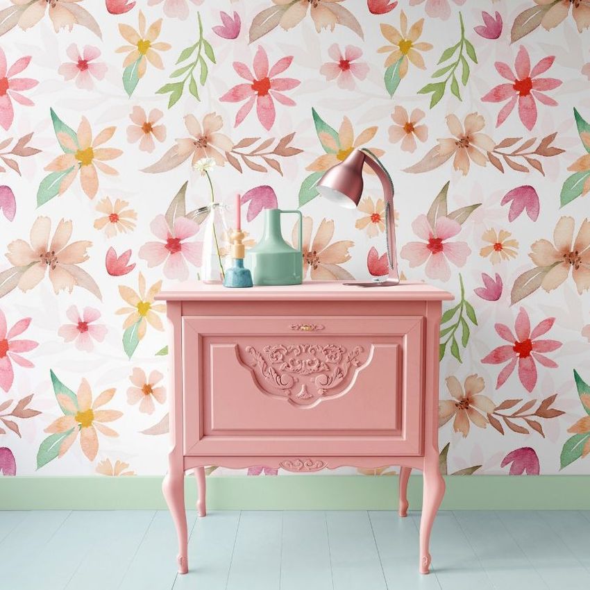 Interior scene mockup featuring a pink vintage cabinet against a floral patterned wallpaper with pastel flowers and green leaves.