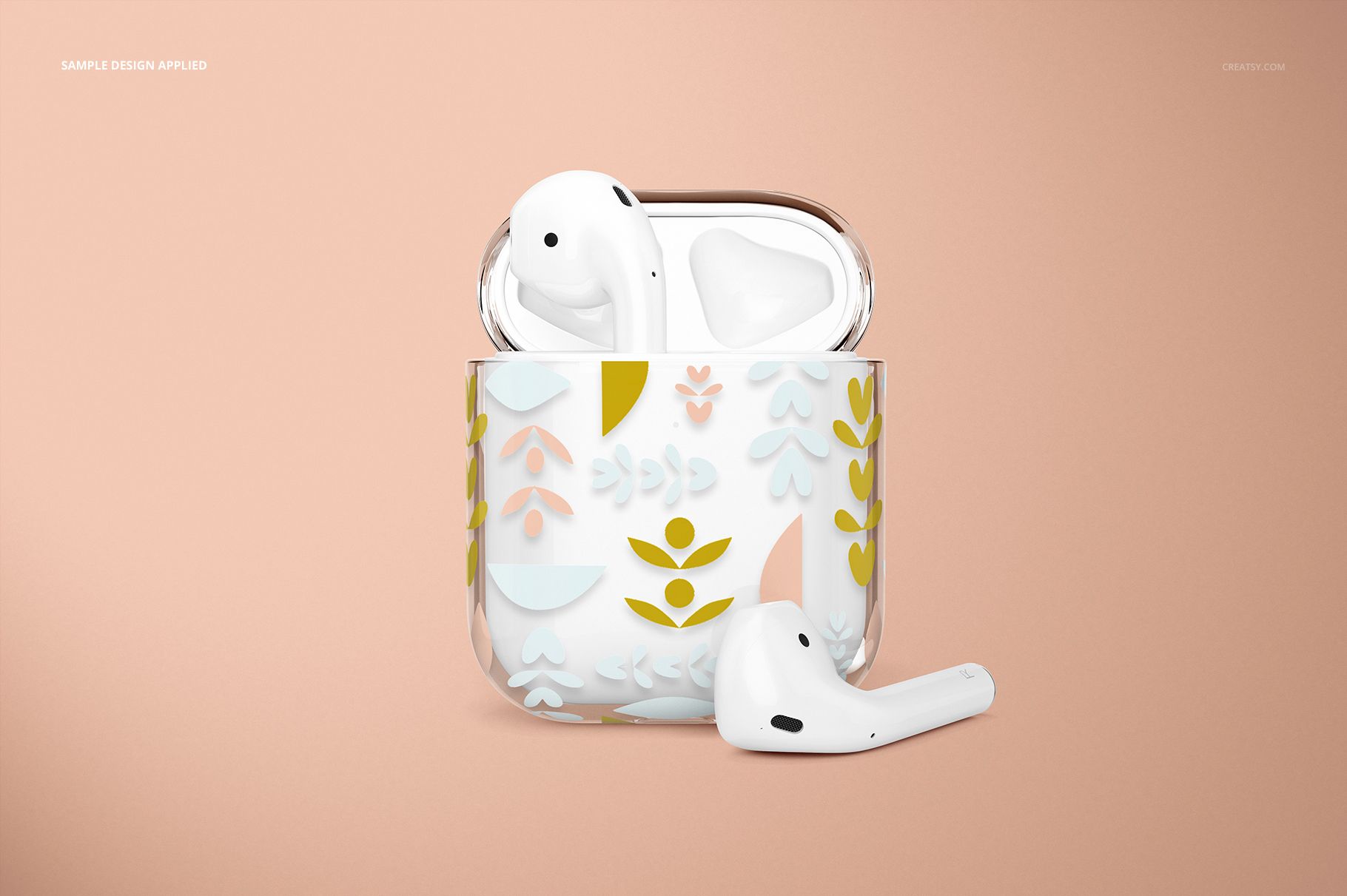 PSD mockup of a clear AirPods case decorated with multicolored nature-inspired motifs, displayed on a light peach surface.