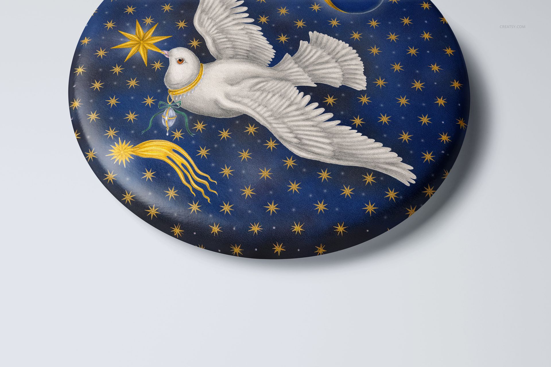 Round ornament mockup featuring a white dove and gold stars on a dark blue background, shown in close-up view.
