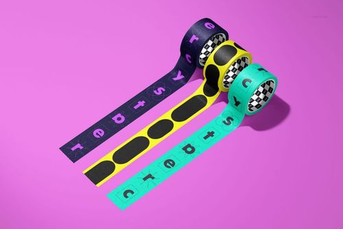 Colorful packaging tape mockup featuring geometric designs and text, displayed diagonally on a pink background.