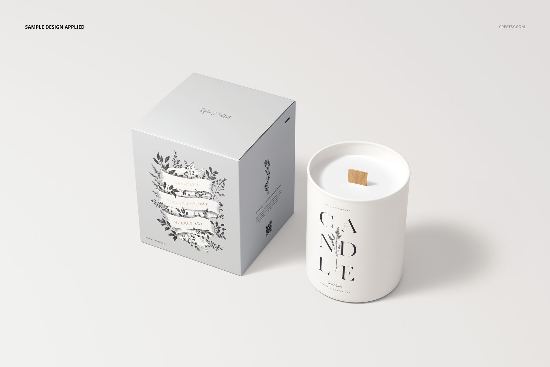 Wooden wick candle mockup and box in white, decorated with simple black floral graphics, displayed side by side on a clean surface.