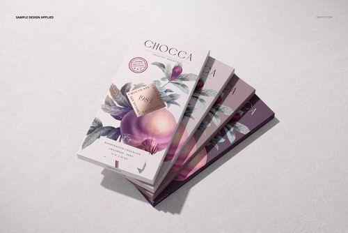 Angled top view of chocolate bar packaging mockup set featuring soft purple and pink floral designs, arranged in a layered stack.