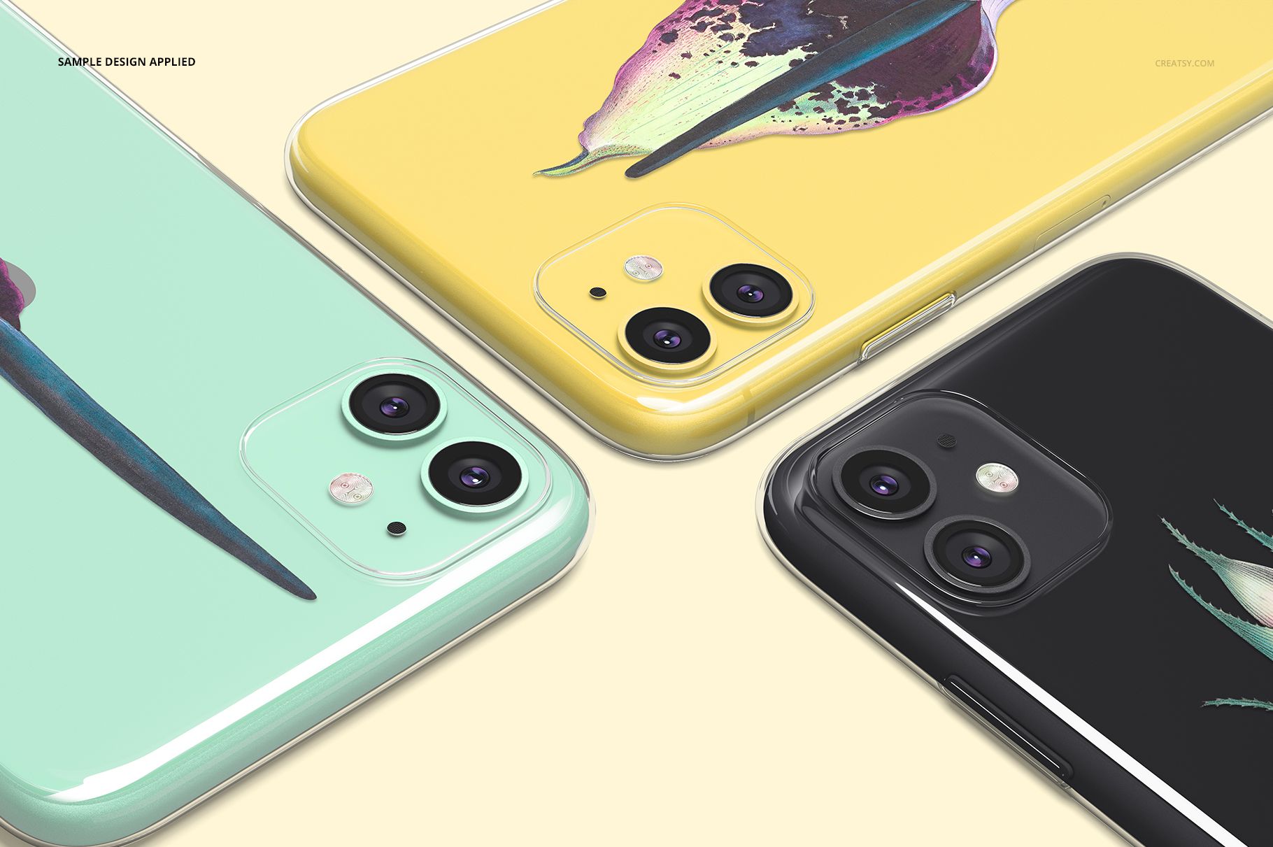 Close-up of iPhone 11 clear case mockup set showing pastel backgrounds and various illustrated designs.