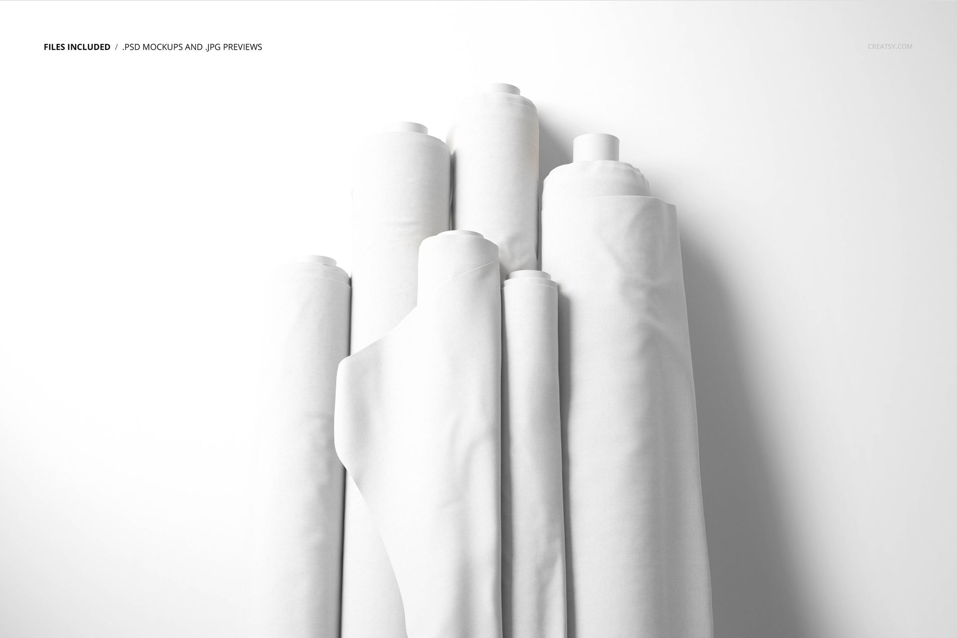 Fabric rolls mockup showing a collection of unpatterned white textiles, viewed from a top-down perspective.