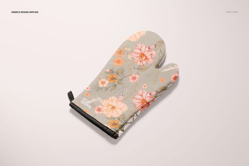 Floral oven mitt mockup featuring orange and pink flowers on a light gray surface, shown from above.