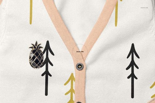 Close-up front view of a baby cardigan sweater mockup with beige trim, black buttons, and abstract tree patterns.