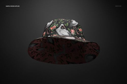 Front view of a reversible bucket hat mockup featuring a dark floral and bird pattern on a black background.