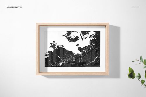 Horizontal wooden picture frame mockup with a black and white abstract print, shown from a front view on a white wall.