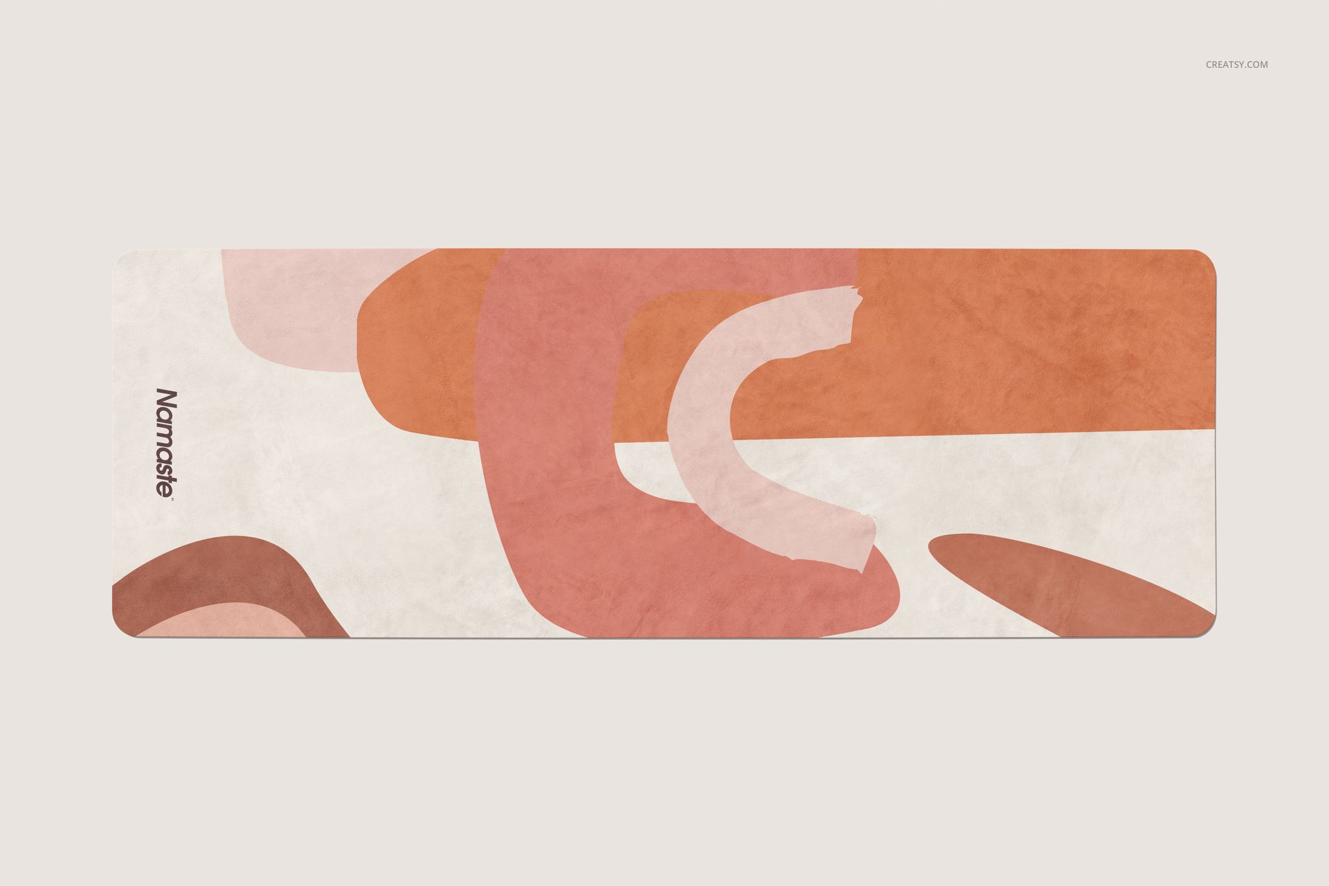 Top view of a yoga mat mockup featuring a modern abstract pattern in terracotta, beige, and white colors.