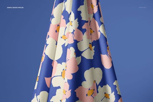 PSD mockup showing hanging cotton fabric with bold cream, pink, and orange flower shapes against blue backdrop.