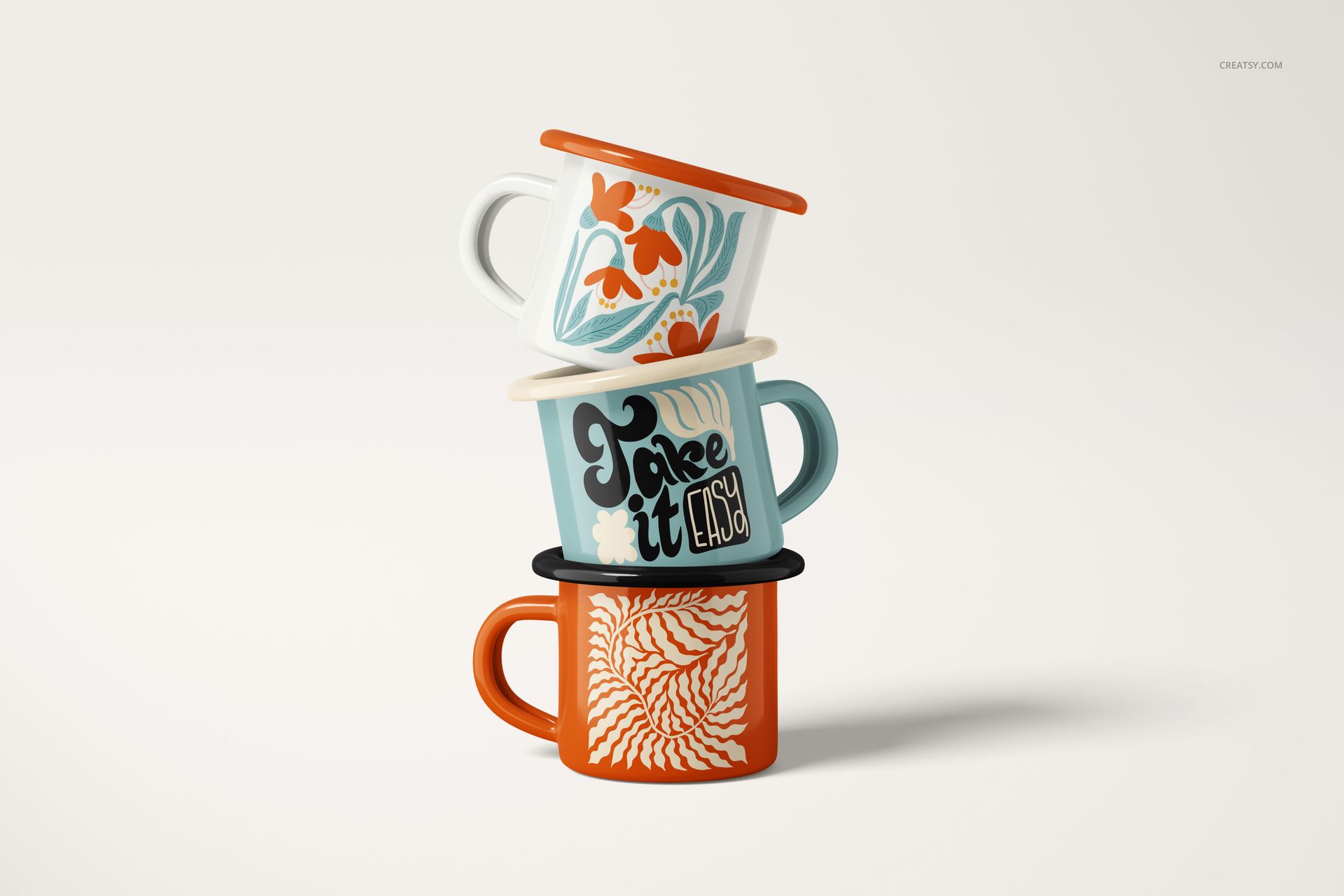 Stack of three 100ml enamel mugs with colorful designs, shown on a light background in a front view.
