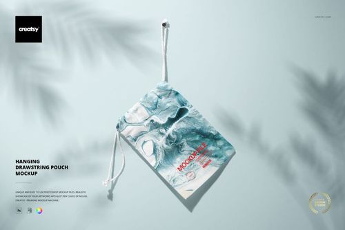 Hanging drawstring bag mockup with a marble design in blue and white tones, suspended by white cords against a pale surface.