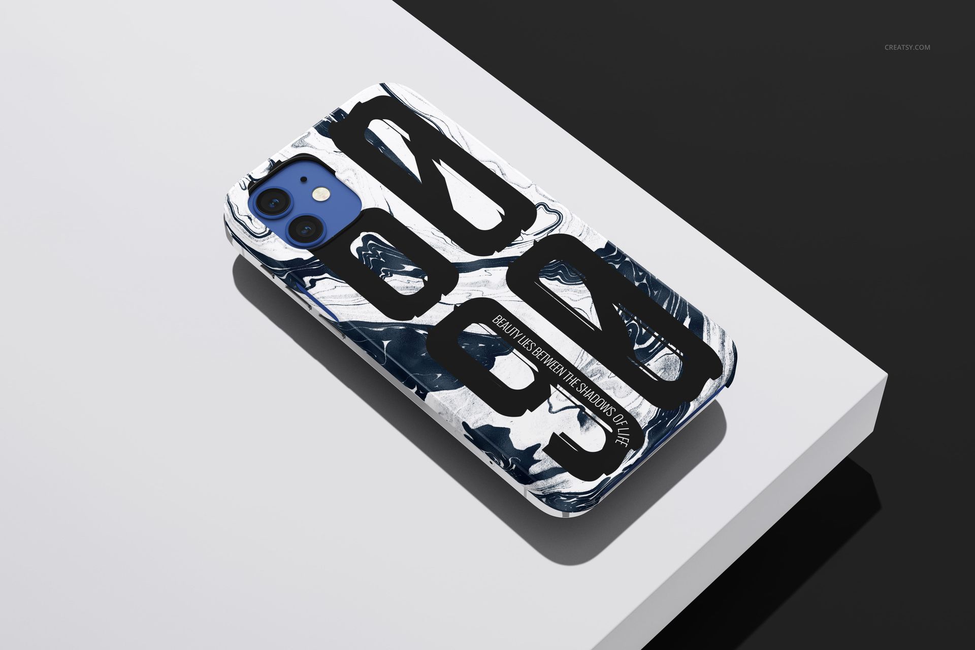 iPhone 12 case mockup featuring glossy finish and bold black graphics on a marbled white background, angled view.