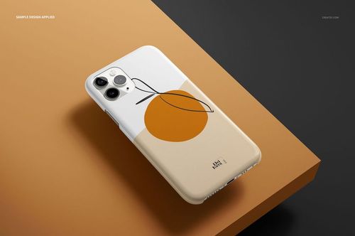 Glossy iPhone 11 Pro case mockup with abstract orange and beige design, shown in a three-quarter view on a brown surface.