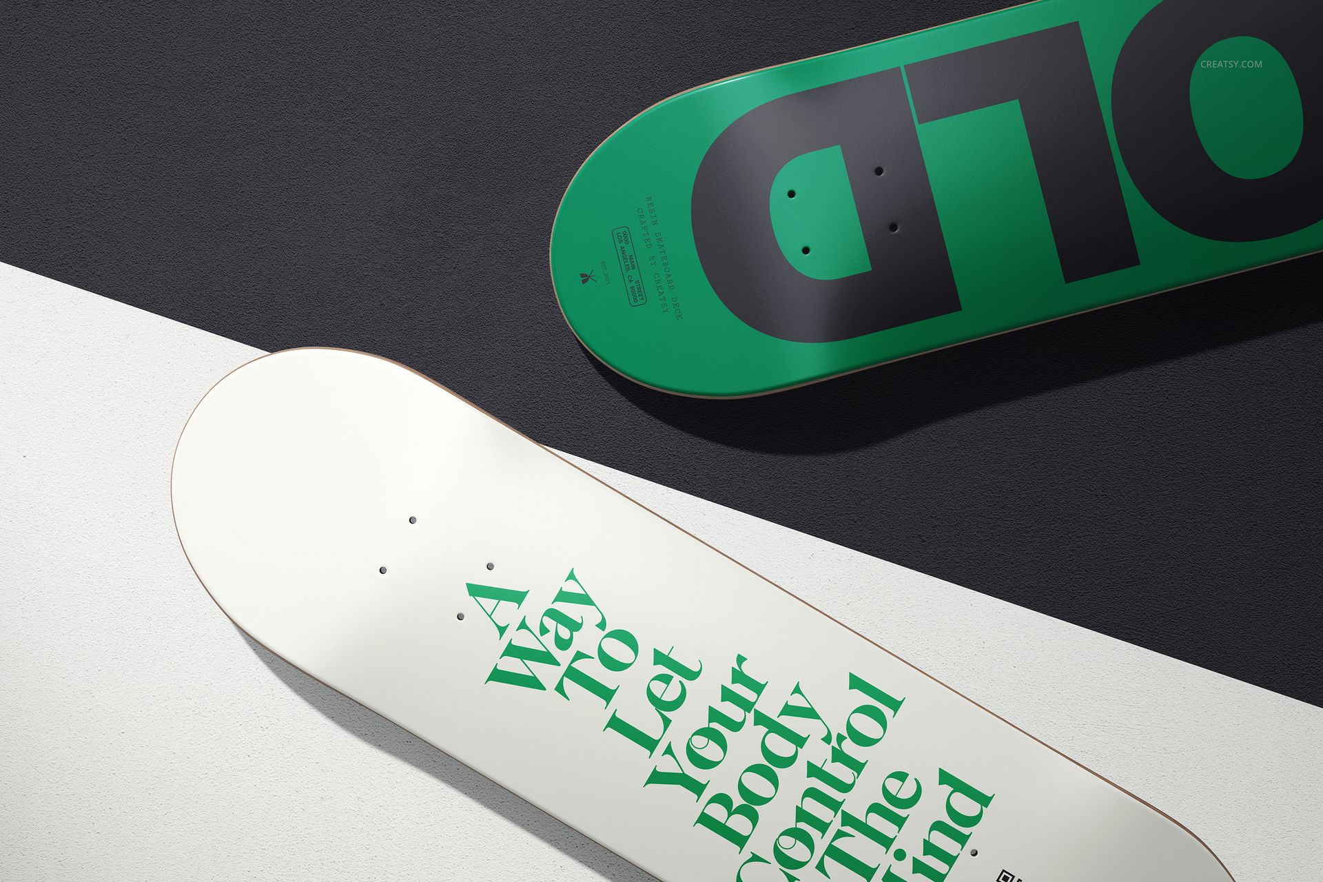 Skateboard deck PSD mockup featuring a white deck with green text and a green deck with large black letters on a textured surface.