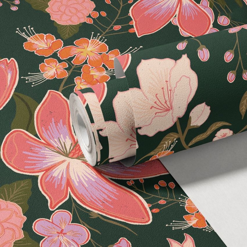Non-woven vinyl wallpaper mockup featuring a rolled sheet with pink and orange floral patterns on a dark green background.