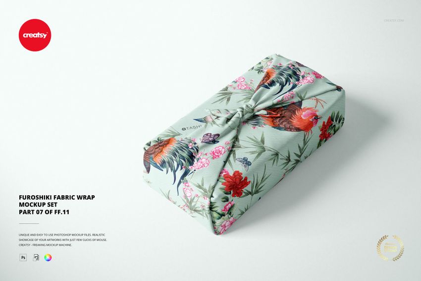 Furoshiki fabric wrap mockup featuring a pastel green textile with colorful flowers and rooster design, front view.
