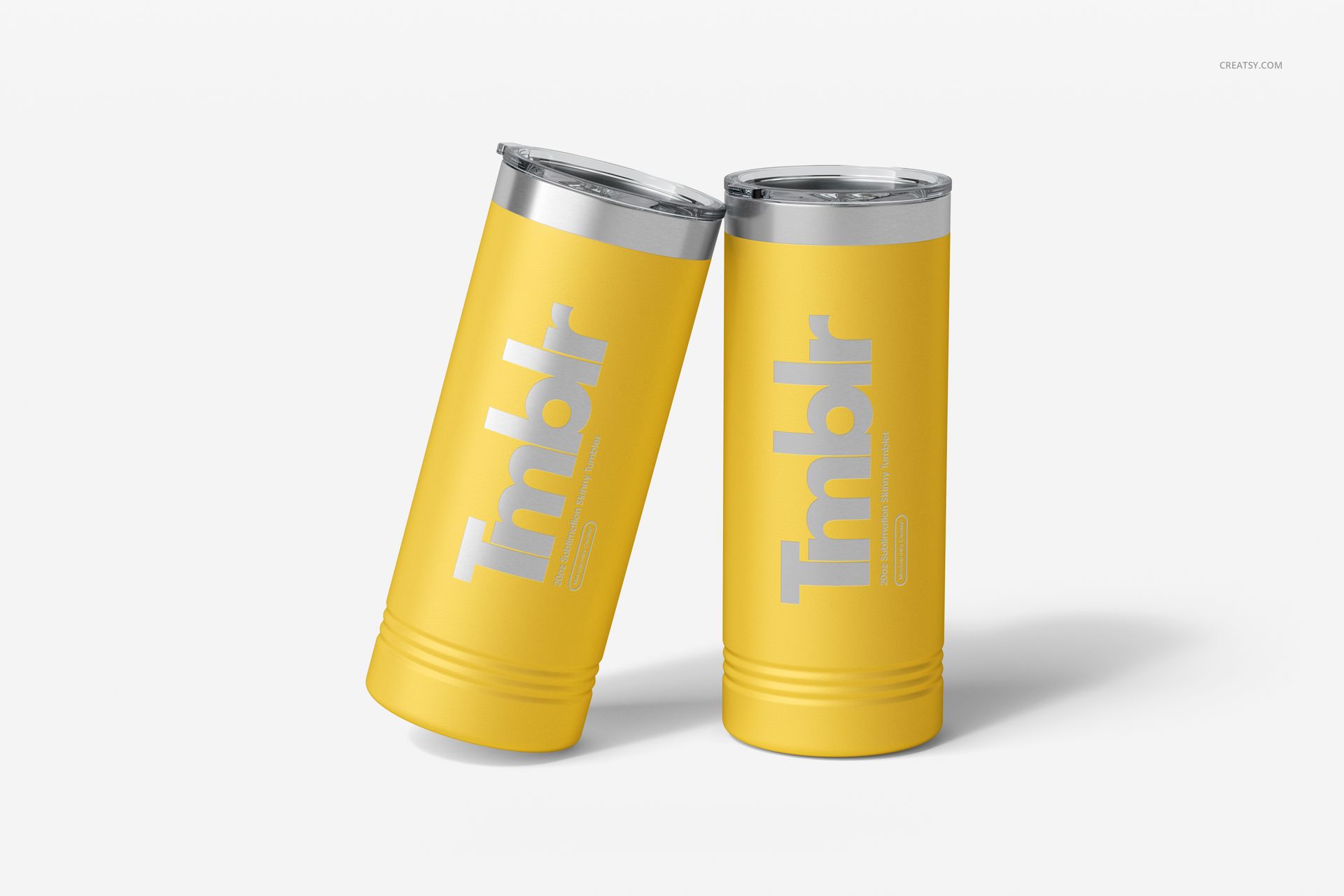 Pair of 22oz yellow skinny tumblers with metallic lids, angled together on a clean white surface, mockup style.
