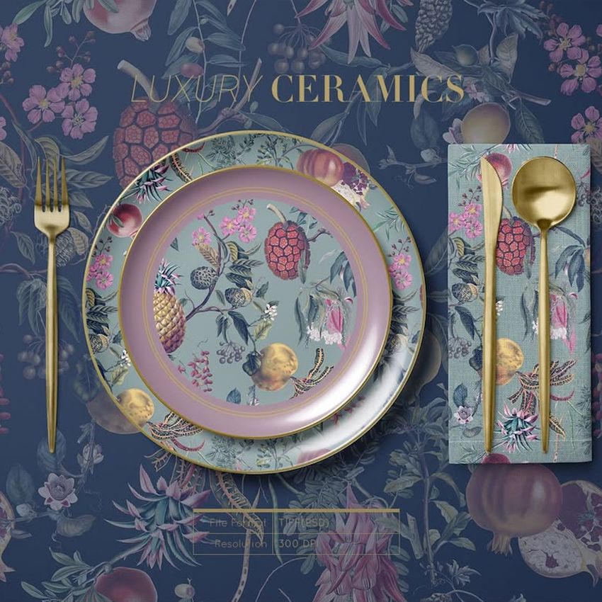Placemat napkin plate mockup featuring a decorative plate, matching napkin, and gold cutlery on a floral patterned background.