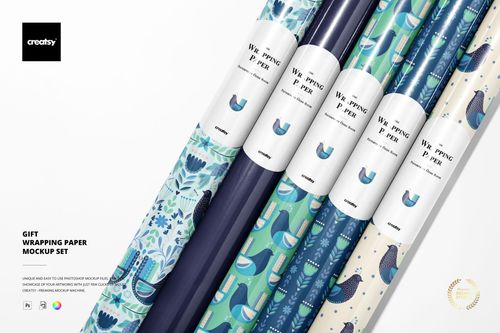 Top view of several patterned gift wrapping paper rolls in shades of blue and green, shown as part of a PSD mockup set.