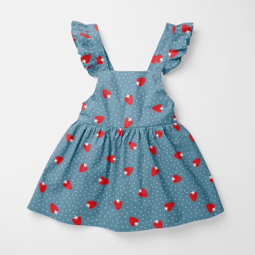 Baby dress mockup featuring a blue dress with red strawberry pattern and white dots, displayed flat on a white background.