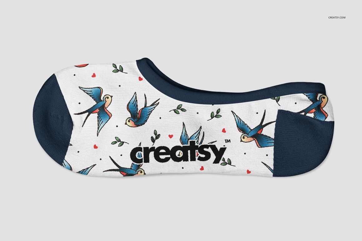 Mockup of a low-cut adult sock with a bird and heart print, navy blue accents, and a white background seen from the side.