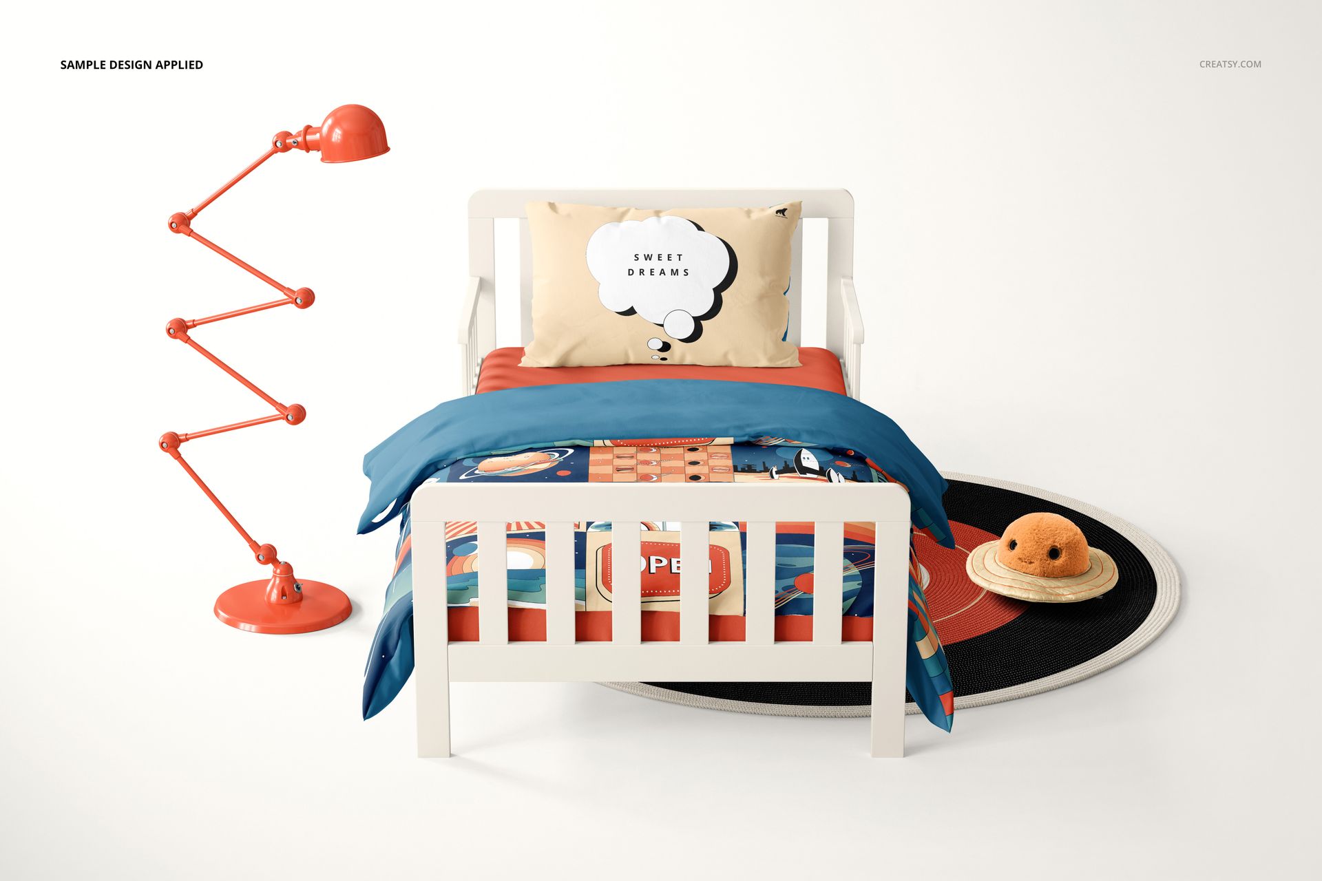 Toddler bedding mockup featuring a white bed, vibrant duvet and pillow, orange desk lamp, and circular rug.