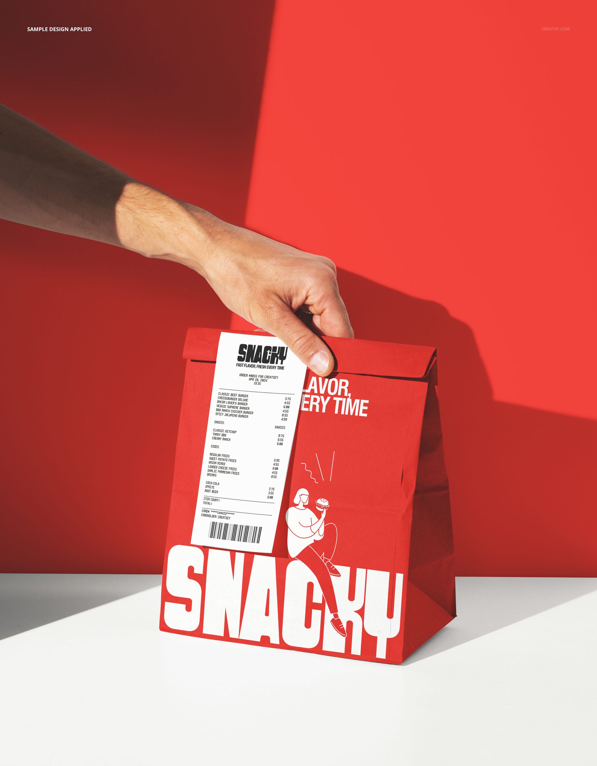 PSD mockup featuring a red take-out paper bag with bold white text and an attached receipt, hand reaching for it.