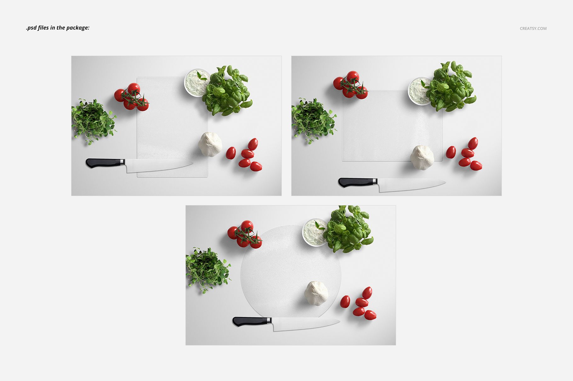 PSD mockup showing circular and rectangular glass cutting boards surrounded by tomatoes, herbs, garlic, and tzatziki dip.