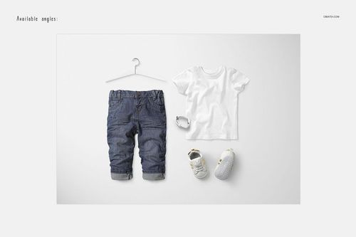 Front view of a baby t-shirt mockup in white, displayed alongside denim pants, shoes, and a bracelet on a plain background.